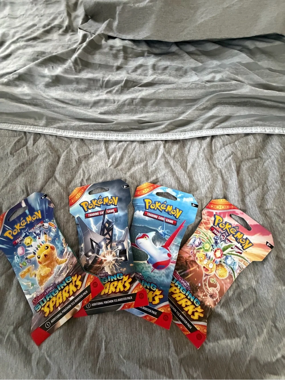 Pokemon  Surging sparks  TCG Booster Pack bundle of 4